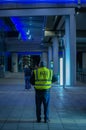 Vertical rear shot of a taxi driver in the Manchester Airport, United Kingdom