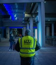 Vertical rear shot of a taxi driver in the Manchester Airport, United Kingdom