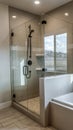 Vertical Rectangular walk in shower stall with half glass enclosure and black shower head Royalty Free Stock Photo