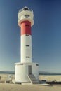 Vertical of red and white lighthouse in the Natural park of Ebro Delta, Spain Royalty Free Stock Photo
