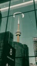 Vertical reflection of the Olympiaturum tower from a glass window