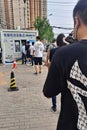 Vertical of residents queueing for nucleic acid tests on street under China's zero covid policy