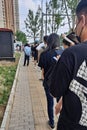 Vertical of residents queueing for nucleic acid tests on street under China's zero covid policy