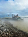 Vertical of Riverboat docked in New Orleans, Louisiana, United States on misty morning Royalty Free Stock Photo