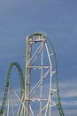 a vertical roller coaster with green tracks