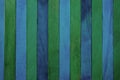 Vertical rough indigo blue and green theme wooden partition wall texture background.