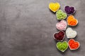 Vertical row of heart-shaped bowls of vegetables