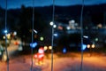 Vertical rows of luminous garlands against the background of the dark city Christmas decorations