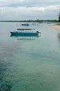 Vertical of sailing boats parked in a blue sea under a cloudy sky Royalty Free Stock Photo