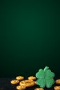 Vertical Saint Patricks day background with gold horseshoe and four leaf clovers on a dark background Royalty Free Stock Photo