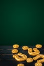 Vertical Saint Patricks day background with gold horseshoe and four leaf clovers on a dark background Royalty Free Stock Photo