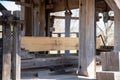 Vertical saw milling lumber in colonial American sawmill side view