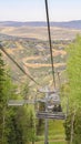 Vertical Scenic aerial view on a summer day of ski resort in Park City with chairlifts Royalty Free Stock Photo