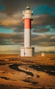 Vertical scenic view of the lighthouse from Parc Natural del Delta de l\'Ebre in Riumar, Spain