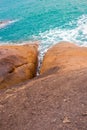 Vertical seascape. A stone mountain with a crevice goes into the sea. Grandmother and Grandfather Rocks on Koh Samui in Royalty Free Stock Photo