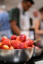 Vertical selective focus of a bowl of fresh strawberries in a kitchen Royalty Free Stock Photo