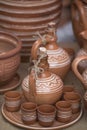 Vertical selective focus closeup of artistic ceramic pots on the table