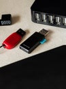 Vertical selective focus closeup of flash drives, and multiple USB ports on the desk Royalty Free Stock Photo