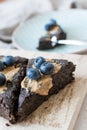 Vertical selective focus high angle shot of a delicious chocolate blueberry cake Royalty Free Stock Photo