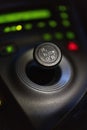 Vertical selective focus shot of the black gear shift knob of a car Royalty Free Stock Photo