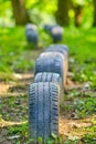 Vertical selective focus shot of car tires row in nature Royalty Free Stock Photo