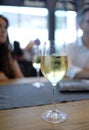 Vertical selective focus shot of a glass of cold white wine Royalty Free Stock Photo