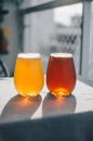Vertical selective focus shot of two glasses of wheat beer Royalty Free Stock Photo