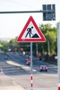 Vertical selective focus shot of under construction road signage in the street