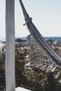 Vertical selective focus shot of white hammock on the beach