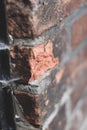 Vertical shallow focus closeup shot of an old brick wall