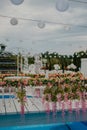 Vertical shallow focus shot of an outdoor wedding ceremony reception decorations Royalty Free Stock Photo