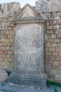 Vertical shor of the writing on the wall of the famous Roman ruins in Timgad, Algeria