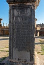 Vertical shor of the writing on the wall of the famous Roman ruins in Timgad, Algeria