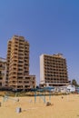 Vertical shot of abandoned hotels on the beach of the ghost town resort of Varosha