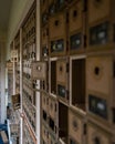 Vertical shot of abandoned mailboxes in an old post office on Adak Island