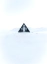 Vertical Shot Of An Abandoned Triangular Cabin In Snaefellsnes Iceland Covered In White Snow