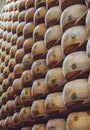 Vertical shot of the aging Parmigiano Reggiano cheese stacks