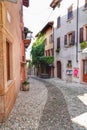 Vertical shot of an alley in Malcesine on the eastern shore of Lake Garda in Verona, Italy