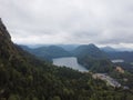 A vertical shot of an amazing view of mountains and a small lake among them Royalty Free Stock Photo