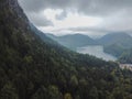 A vertical shot of an amazing view of mountains and a small lake among them Royalty Free Stock Photo