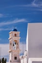 Vertical shot of the Anastasis Church with its Blue Dome and Tower in Santorini, Greece