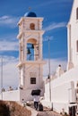 Vertical shot of the Anastasis Church with its Blue Dome and Tower in Santorini, Greece