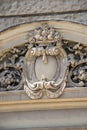 Vertical shot of an ancient carving on a building captured on a sunny day