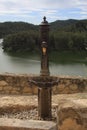 Vertical shot of an ancient old-style water fountain with a faucet Royalty Free Stock Photo