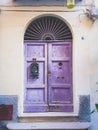 Vertical shot of an ancient purple door - great for a cool background or wallpaper