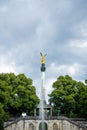 Vertical shot of the Angel of Peace monument in Munich, Germany under the dark cloudy sky