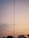 Vertical shot of an antenna against a dusk sky