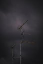 Vertical shot of an antenna in the stormy weather