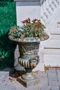 Vertical shot of an antique decorative vase with flowers Royalty Free Stock Photo