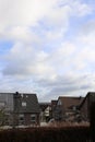 Vertical shot of apartment buildings in a neighborhood under a cloudy sky Royalty Free Stock Photo